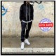 Tuta black ciniglia maculata zip e cappuccio nera